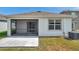 Rear patio with screened enclosure, and sliding glass doors, providing a peaceful outdoor retreat at 32714 Brooks Hawk Ln, Wesley Chapel, FL 33543