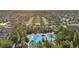 Aerial view of community pool and clubhouse, surrounded by lush landscaping in a desirable neighborhood at 32714 Brooks Hawk Ln, Wesley Chapel, FL 33543