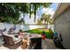 Serene backyard with a patio, cozy seating, and lush green lawn, perfect for outdoor enjoyment at 3301 8Th N Ave, St Petersburg, FL 33713