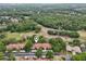 Lovely aerial view of condo community with lush green landscaping, golf course, and convenient covered parking at 3505 Tarpon Woods Blvd # K409, Palm Harbor, FL 34685