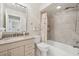 Bathroom featuring a vanity with granite countertop and a shower over tub at 3505 Tarpon Woods Blvd # K409, Palm Harbor, FL 34685