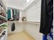 Walk-in closet with shelves and hanging rods offering ample storage space for clothes and accessories at 3505 Tarpon Woods Blvd # K409, Palm Harbor, FL 34685