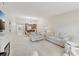 Open living area and dining room with neutral colors and traditional-style furnishings at 3505 Tarpon Woods Blvd # K409, Palm Harbor, FL 34685