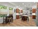 Open-concept kitchen featuring stainless steel appliances, white countertops, and tile flooring at 375 5Th N Ave, Safety Harbor, FL 34695