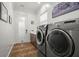 Bright laundry room with stainless steel washer and dryer, and ample storage at 375 5Th N Ave, Safety Harbor, FL 34695