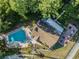 Overhead view of a pool, clubhouse, and outdoor lounge area, perfect for relaxation at 3956 Tarpon Pointe Cir, Palm Harbor, FL 34684