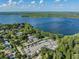 Beautiful aerial view featuring the adjacent lake, boat and RV parking at 3956 Tarpon Pointe Cir, Palm Harbor, FL 34684