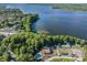 Aerial view of the community showcasing lake access and a private pool at 3956 Tarpon Pointe Cir, Palm Harbor, FL 34684
