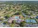 Community with a golf course, pool, clubhouse, tennis courts, and green landscaping at 3956 Tarpon Pointe Cir, Palm Harbor, FL 34684