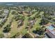 Breathtaking aerial view of a golf course community with many lakes at 3956 Tarpon Pointe Cir, Palm Harbor, FL 34684