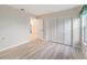 This bedroom features wood-look floors, double closets and neutral walls at 3956 Tarpon Pointe Cir, Palm Harbor, FL 34684