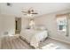 Bright bedroom features a ceiling fan, neutral walls and wood-look flooring at 3956 Tarpon Pointe Cir, Palm Harbor, FL 34684