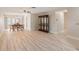 Bright and airy dining area featuring stylish flooring and an elegant dining set with seating for six at 3956 Tarpon Pointe Cir, Palm Harbor, FL 34684