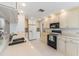 Traditional kitchen with tile floors, neutral countertops, and a double stainless steel sink at 3956 Tarpon Pointe Cir, Palm Harbor, FL 34684
