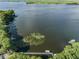 Scenic aerial view of the calm lake featuring a dock at 3956 Tarpon Pointe Cir, Palm Harbor, FL 34684