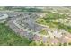 Aerial view of a community showcasing lush landscaping, ponds, and well-maintained homes at 4195 Barletta Ct, Wesley Chapel, FL 33543