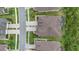 An aerial view of a home showcasing the roof, driveway, and landscaping at 4195 Barletta Ct, Wesley Chapel, FL 33543