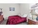 Cozy bedroom with a double bed, neutral walls, blinds, and a dresser creating a comfortable personal space at 4195 Barletta Ct, Wesley Chapel, FL 33543