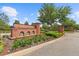 Santeri community entrance featuring a brick sign, manicured landscaping, and gated entry at 4195 Barletta Ct, Wesley Chapel, FL 33543