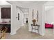 Inviting hallway with tile flooring, curved walls, and decorative accents with sightlines to rooms at 4195 Barletta Ct, Wesley Chapel, FL 33543