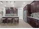 Well-equipped kitchen with stainless steel appliances, granite countertops, and dark wood cabinetry at 4195 Barletta Ct, Wesley Chapel, FL 33543
