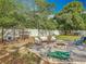 Spacious backyard featuring a fire pit and lounge seating at 4435 Lamson Ave, Spring Hill, FL 34608