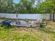 Backyard featuring a fire pit and seating area for outdoor entertaining at 4435 Lamson Ave, Spring Hill, FL 34608