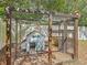 Backyard chicken coop with custom coop house inside at 4435 Lamson Ave, Spring Hill, FL 34608