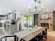 Open concept with kitchen, dining area and view of outdoor space at 4435 Lamson Ave, Spring Hill, FL 34608