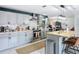 Spacious kitchen featuring light grey cabinetry, stainless appliances, and modern finishes at 4435 Lamson Ave, Spring Hill, FL 34608