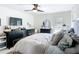 Comfortable main bedroom with a ceiling fan, dresser, and crib at 4435 Lamson Ave, Spring Hill, FL 34608