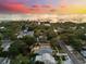 Sunset view of the water over a neighborhood with tree-lined streets at 475 Crystal Beach, Crystal Beach, FL 34681