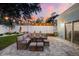 Outdoor patio featuring comfortable seating, pavers, and a beautiful sky at twilight at 475 Crystal Beach, Crystal Beach, FL 34681