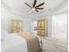 Bright bedroom with tray ceiling, wooden floors and built-in wardrobe furniture at 475 Crystal Beach, Crystal Beach, FL 34681