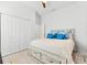 This bright bedroom has a ceiling fan, carpet, and a large closet with plenty of space at 475 Crystal Beach, Crystal Beach, FL 34681