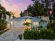 Beautiful single-story home featuring a well-manicured front yard and an attached two-car garage on a gray brick driveway at 475 Crystal Beach, Crystal Beach, FL 34681