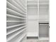 This walk-in closet provides ample storage with rows of shelving, hanging rods, and shoe storage at 475 Crystal Beach, Crystal Beach, FL 34681