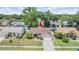 Beautiful aerial view showcasing the home's location in a desirable neighborhood with mature trees at 4915 Fort Peck Rd, New Port Richey, FL 34655