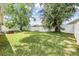 Spacious backyard enclosed with a white fence, perfect for outdoor recreation and gardening at 4915 Fort Peck Rd, New Port Richey, FL 34655