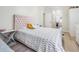 Bedroom featuring wood floors and decorative headboard that creates a comfortable and stylish space at 4915 Fort Peck Rd, New Port Richey, FL 34655