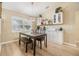 Dining room showcases a modern chandelier, lots of natural light, and built in storage at 4915 Fort Peck Rd, New Port Richey, FL 34655