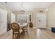 Elegant dining room with a modern chandelier, a round table, and tasteful decor at 4915 Fort Peck Rd, New Port Richey, FL 34655