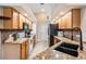 Bright kitchen boasts granite countertops, stainless appliances, and an island with sink at 4915 Fort Peck Rd, New Port Richey, FL 34655