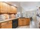 Kitchen showcases granite countertops, wooden cabinets, and stainless appliances at 4915 Fort Peck Rd, New Port Richey, FL 34655