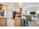Kitchen with an island, granite countertops, stainless appliances, and open access to living room at 4915 Fort Peck Rd, New Port Richey, FL 34655