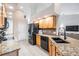 Kitchen features granite countertops, stainless appliances, and wooden cabinets at 4915 Fort Peck Rd, New Port Richey, FL 34655