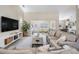 Relaxing living room with views to the dining and desk areas, featuring ample seating at 4915 Fort Peck Rd, New Port Richey, FL 34655