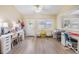 Well-lit office space featuring dual desks, a bright window, and stylish decor, perfect for productivity at 4915 Fort Peck Rd, New Port Richey, FL 34655