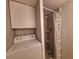 Cozy bathroom with a shower and laundry area at 5404 Springwood Blvd # 5404, Pinellas Park, FL 33782