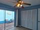 Bedroom featuring a closet and a sliding glass door to a blue walled patio at 5404 Springwood Blvd # 5404, Pinellas Park, FL 33782